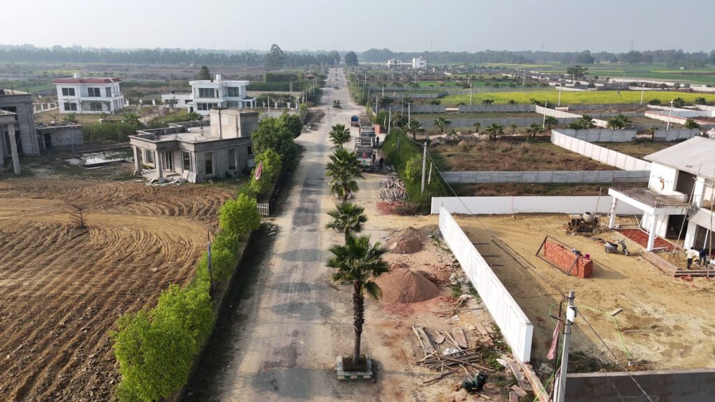 Farmhouse for Sale in Lucknow: The Villagio Unveils Luxury Managed Farmland Near Mohanlalganj 4 Aerial view of The Villagio gated farmhouse for sale in Lucknow along Sai river